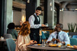 © Marko Geber - Diverse business people having meeting in hotel restaurant