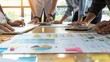 © Natpasit - Close-up of business professionals working together on financial reports at a wooden table, highlighting teamwork and data analysis..