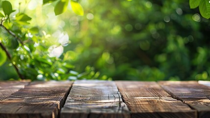 Wall Mural - Wooden Table with a Blurred Green Background