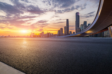 Poster - Asphalt highway road and bridge with modern city buildings scenery at sunset in Guangzhou. car advertising background.