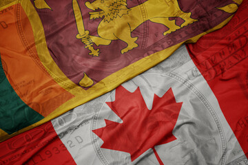Wall Mural - waving colorful flag of sri lanka and national flag of canada on the dollar money background. finance concept.