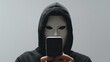 © jessica - a person wearing a mask made from a smartphone, hiding their true face