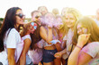 © maxbelchenko - Holi festival. Group of friends having fun at the beach party. Friendship, rest, holidays.