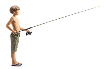 Sticker - Full length profile shot of a boy catching fish with a fishing rod