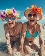 © marimalina - extremely and dramatically happy old ladies in colorful swimsuits with flowers building sand castles on the beach by the ocean. The old ladies laugh loudly. Summer, sunny day