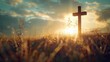 © imagineRbc - A wooden cross stands tall in a field of tall grass illuminated by the warm glow of the setting sun
