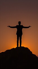 Wall Mural - Silhouette of a Person Standing on a Hill with Arms