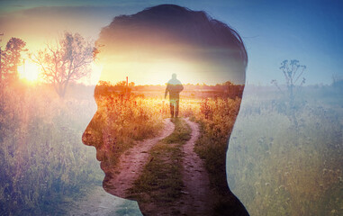 man silhouette on rural landscape background. psychiatry and psychology concept.