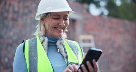 Canvas Print - Mature engineer, woman and smile at phone on construction site for message, review and positive feedback. Female contractor, happy and mobile on worksite for good news, information and loan approval