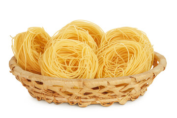 Wall Mural - Italian pasta tagliatelle nest in wicker basket isolated on white background with full depth of field.