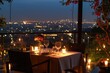 © SaroStock - a table with candles and a view of a city, Romantic candle light dinner at a rooftop restaurant