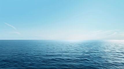 Wall Mural - This image showcases a vast, calm ocean beneath a clear blue sky, with the sunlight adding a serene and peaceful ambiance to the scene, depicting tranquility and openness.