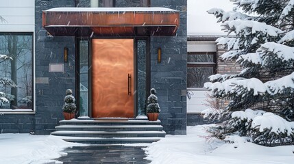 lustrous copper door on a contemporary dark slate house, adding warmth and elegance against the snowy backdrop