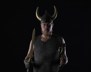 Wall Mural - portrait of a male Viking warrior on a black background