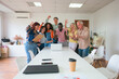 © ADDICTIVE STOCK - Diverse team celebrating success in modern office