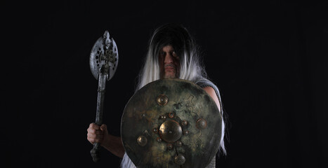 Wall Mural - portrait of a male Viking warrior on a black background