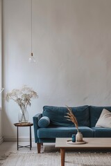 Wall Mural - Cozy living room with blue sofa, coffee table and vase with dry flowers