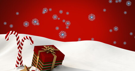 Wall Mural - Image of snow falling over candy canes and christmas present on red background