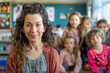 © josepperianes - Photography of european school classroom scene with children in background and the teacher on front.