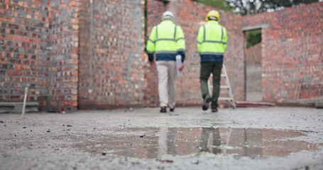 Wall Mural - Architect, people and walking with blueprint at construction site of planning design, process report and building expansion. Back, team and contractor with document, support and project development