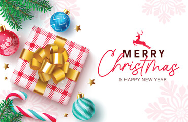 Wall Mural - Christmas greetings vector card design. Merry christmas greetings in checkered gift box, colorful balls, candy cane, fir tree branches ang gold stars elements in winter snowflakes background. Vector 