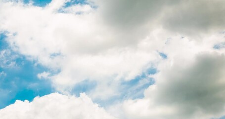 Wall Mural - Timelapse Blue sky fluffy white clouds on summer season bright clear skyline with beautiful cloudscape. Timelapse Panorama blue sky clouds heaven on daylight with copy space. Cloudscape sunny day.