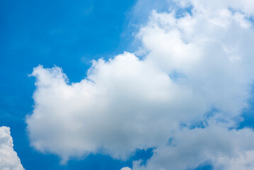 Wall Mural - Tropical summer blue sky fluffy white cloud summertime on light sunny day cloudscape. Clear bright blue skyline spring sunlight climate background. Heaven blue environment ecology high scenic nature.