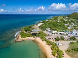 Wall Mural - Aerial coastline view of the beautiful oceanfront town of Rincon, Puerto Rico in the Caribbean