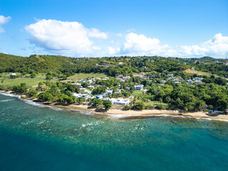 Aerial coastline view of the beautiful oceanfront town of Rincon, Puerto Rico in the Caribbean