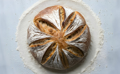 Wall Mural - Rustic sourdough bread loaf with flour dusting