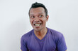 © PRIYO DWI SAPUTRO - Funny and smiling playful teasing of Asian man acts isolated on white background.