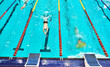 © Pihuliak - Aquatics monofin underwater sports. Athletes competing in blue swimming pool. Finswimming World Championships.