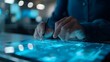 © Tackey - Person using digital tablet with stylus pen on holographic interface in a futuristic workspace. Blue tech glowing screen.
