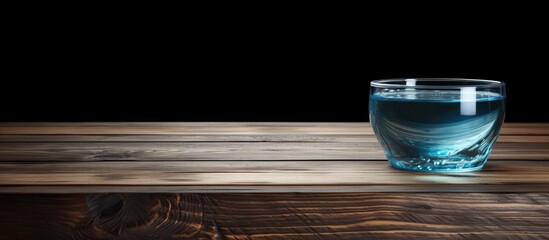 Leinwandbilder - Wooden table with a bowl of transparent water displayed, allowing for text in the copy space image.