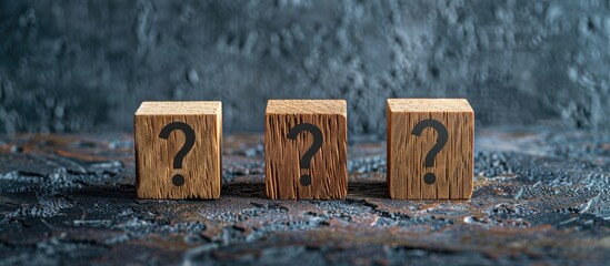 Poster - Three wooden blocks with a question mark, set against a dark background with copy space image.