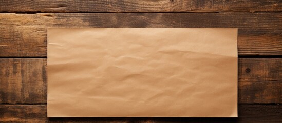 Poster - View from above of plain brown paper on a wooden surface with available copy space for adding text or images in a flat lay composition.