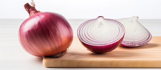 Poster - Onion being sliced on a white wooden surface with background space available for your personal image. with copy space image. Place for adding text or design