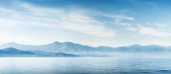 Aufkleber - Panoramic south landscape with a soft focus, featuring a vivid blue sea in the foreground and a distant mountain ridge on the horizon, perfect for a wallpaper with copy space image.
