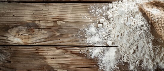 Poster - Close-up view of flour on a rustic wooden table with space for text or images. copy space available