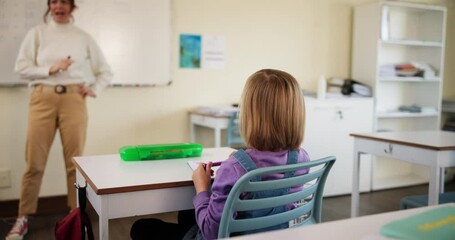 Sticker - Teacher, students and asking in classroom for learning, development and growth as youth with math. Young girl, question and children in kindergarten or elementary school for knowledge, study and test