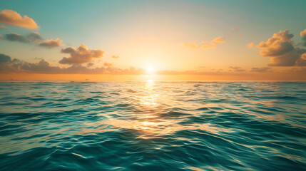 Wall Mural - The sun is setting over the ocean, casting a warm glow on the water