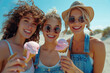 © fanjianhua - Three young women eating ice cream by the seaside
