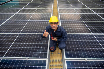 Wall Mural - workers installing solar panels are building a photovoltaic system on the roof.