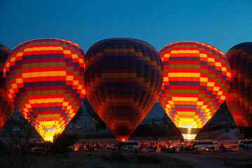 Wall Mural - colorful hot air balloons getting ready for take off early morning in Cappadocia, Turkey