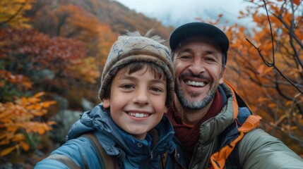 A happy handsome father and cute kid selfie with smartphone together while they travel on family holiday trip. 