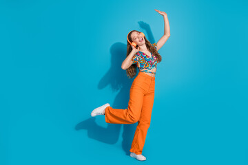 Poster - Full body portrait of lovely young girl headphones dancing wear top isolated on blue color background