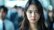 © PeopleWorker - Korea businesswoman angry expression, people blurred in background