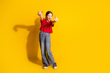 Sticker - Full length portrait of cute little girl dancing empty space wear t-shirt isolated on yellow color background