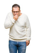 © Krakenimages.com - Middle age arab man wearing glasses over isolated background feeling unwell and coughing as symptom for cold or bronchitis. Healthcare concept.