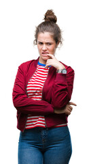 Poster - Beautiful brunette curly hair young girl wearing a jacket over isolated background looking stressed and nervous with hands on mouth biting nails. Anxiety problem.